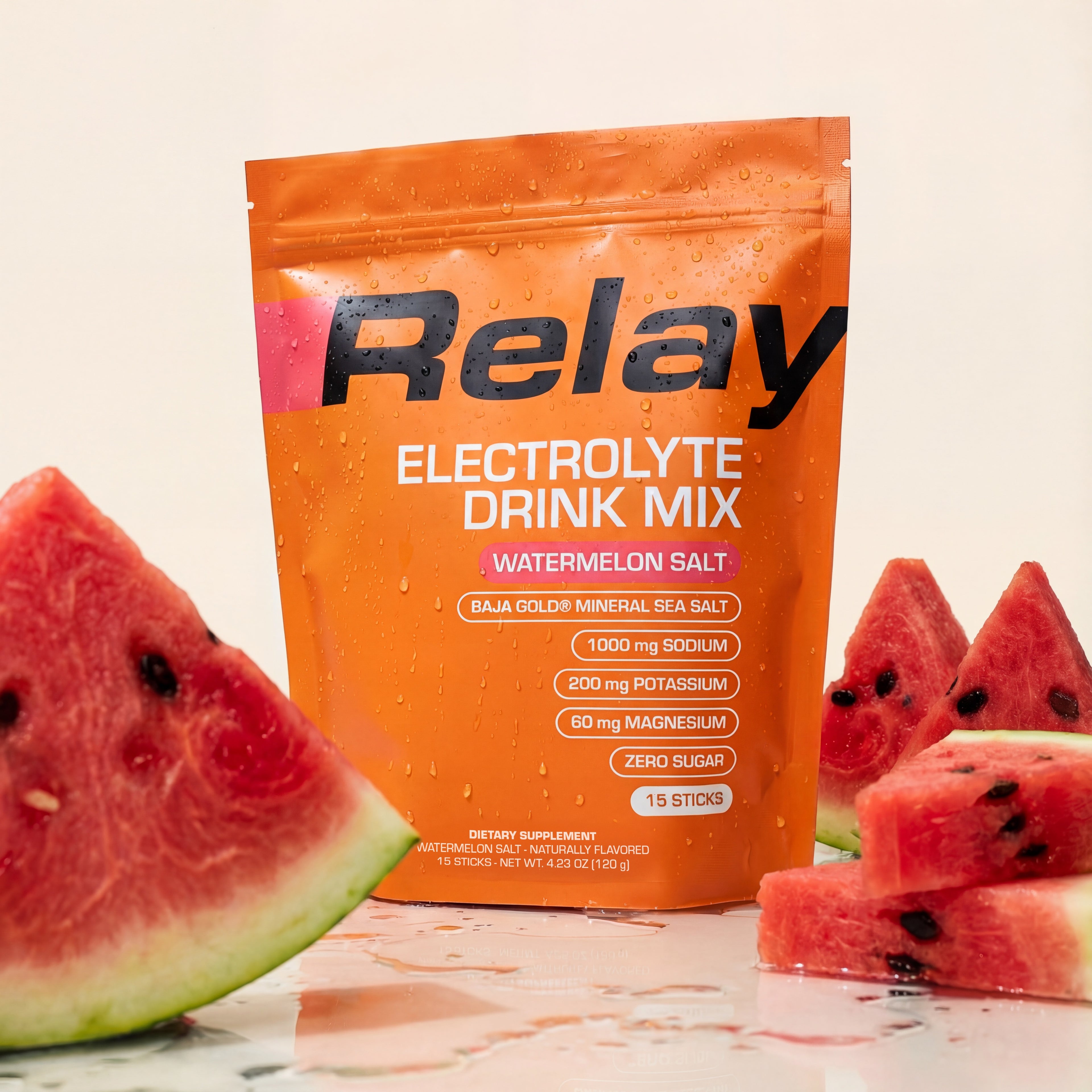 variant:49281673265389 Orange Relay Electrolyte Drink Mix package with watermelon slices on a light background